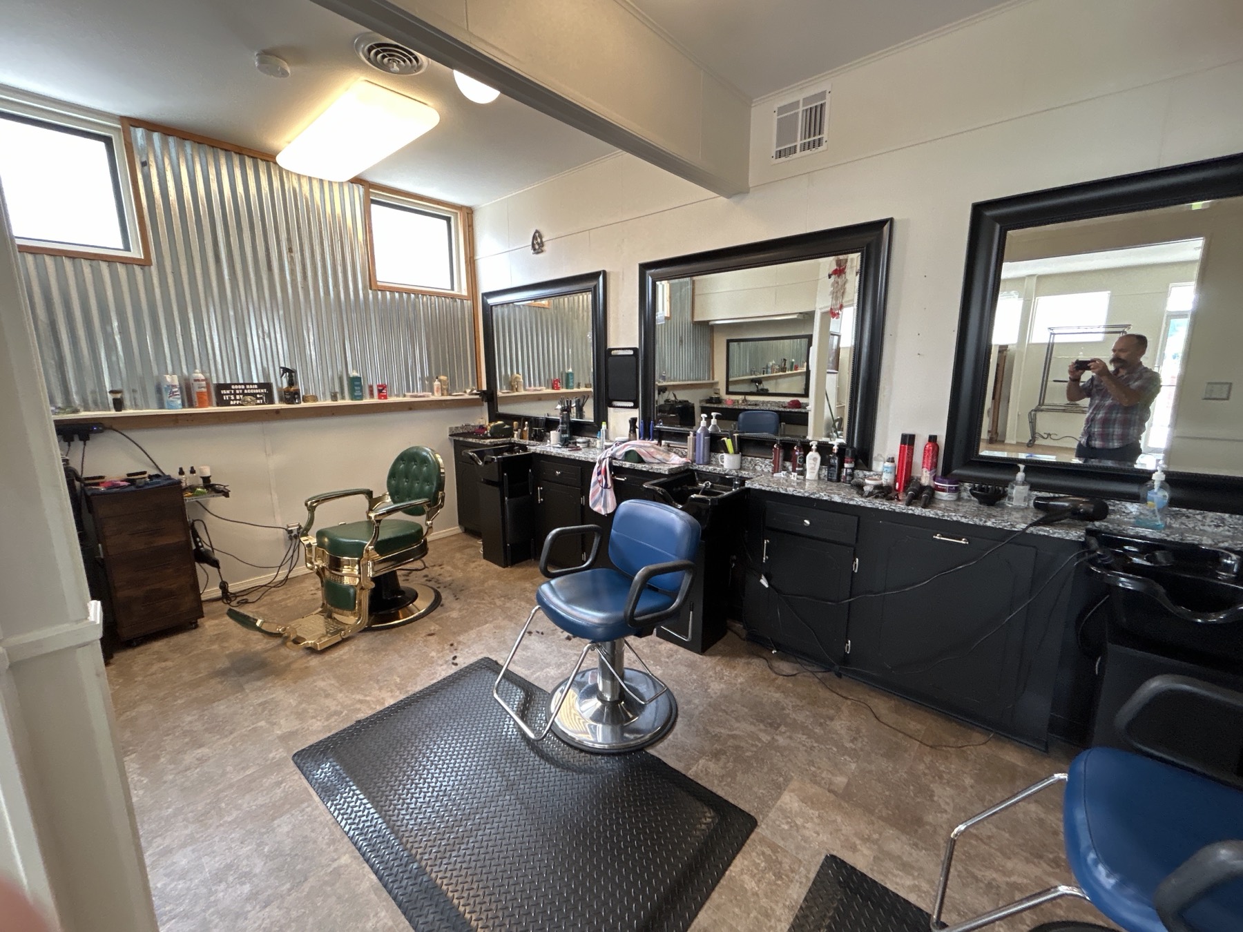 Vintage barber chair and mirrors inside the shop